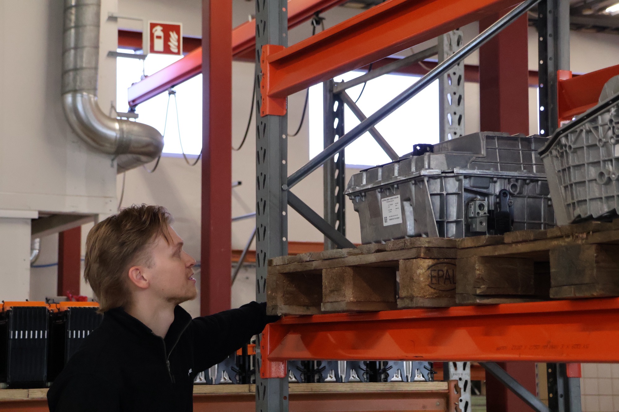 Swapbat technician checking a remanufactured battery pack in the Vantaa warehouse