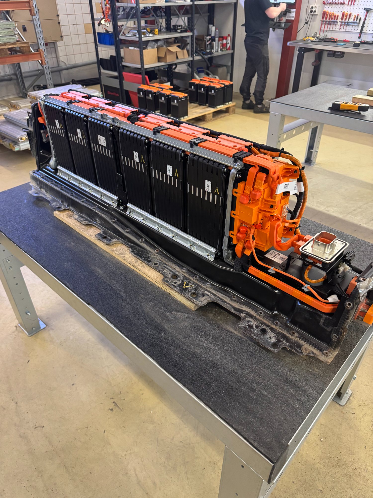 Volvo battery pack on the bench, opened to module level